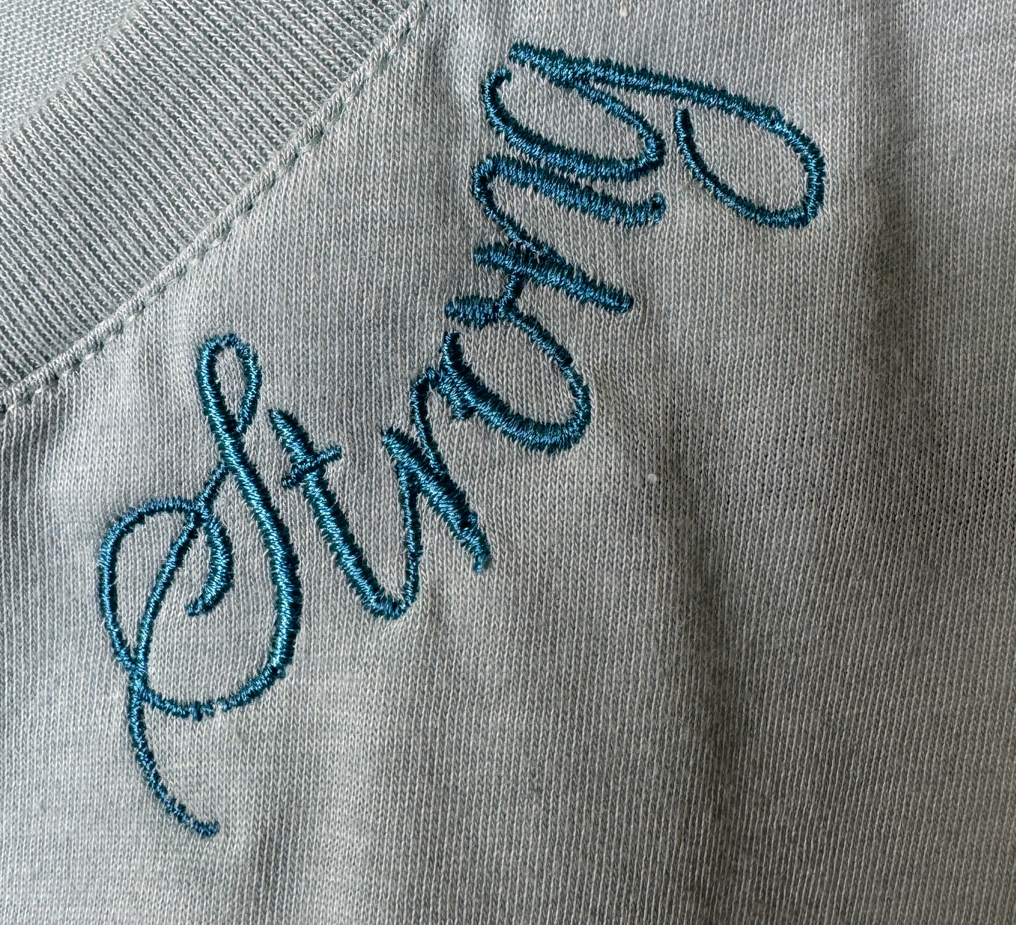 Bella + Canvas Racerback Crop Tank with Embroidered Curved Neckline "Strong"